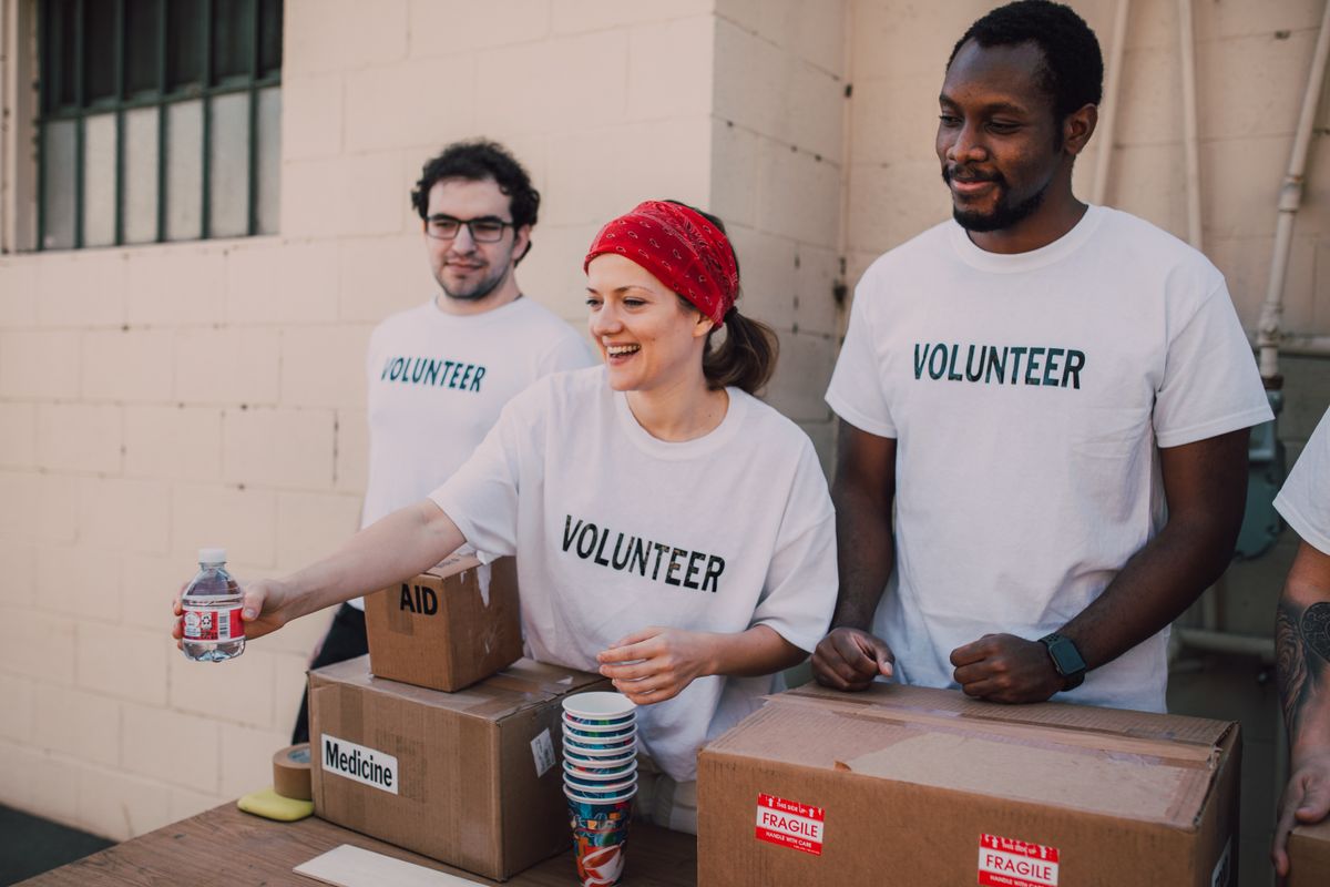 Volunteers handing out water and aid supplies